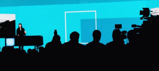 Female Speaker On The Stage At Media Press Conference